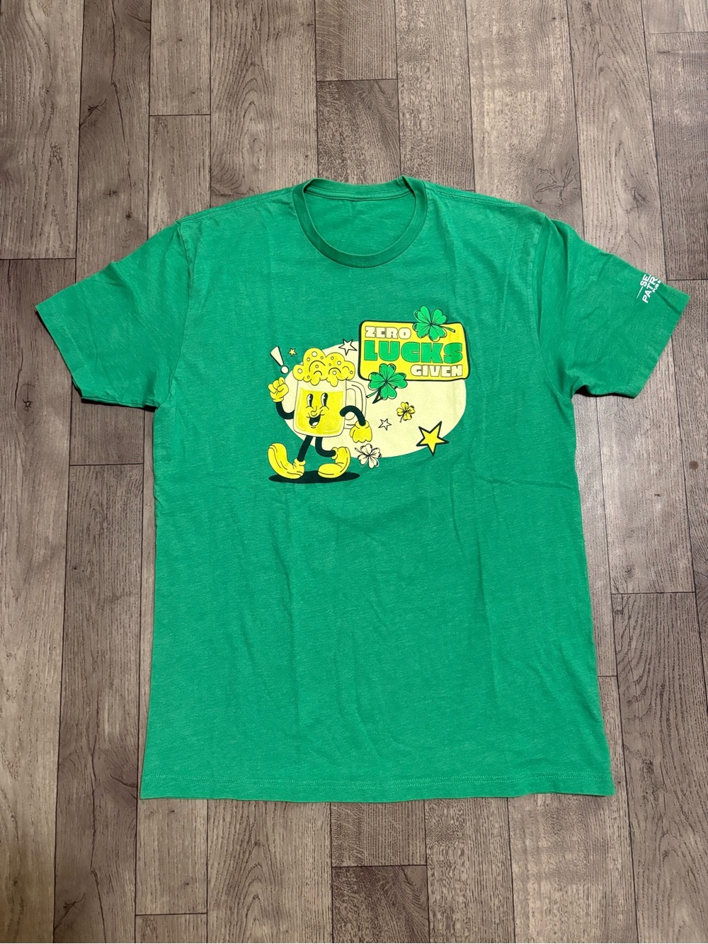 Green Graphic Tee with Yellow Cartoon Beer and 'Zero Lucks Given'